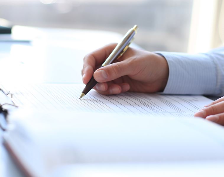 A man filing out document